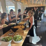 And the coolest couple award goes to... 🥁🏆!!
After being in the industry for almost 3 decades, there are very few things we haven't seen before. But Lilly and Tyler blew us away this weekend ❤️. As part of dinner service, they asked to be a part of serving their guests to have an opportunity to see everyone, say hello, and individually thank them for being a part of their special day. WOW! This is something that rings so true to the core of what we are at Black Woods... our love language is service - and serving something as simple but intimate as a meal. 
Plus, we think those catering aprons look pretty dang good on them 😉.
Thank you Lilly and Tyler for choosing Black Woods and for sharing this moment with us.. this is one we won't soon forget. Cheers to the newlyweds!